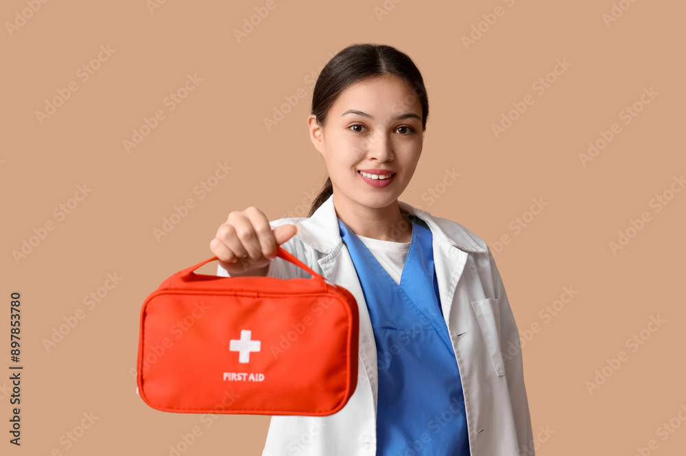 Sticker asian female doctor with first aid kit on brown background