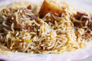  mutton biryani meal in a plate on table.