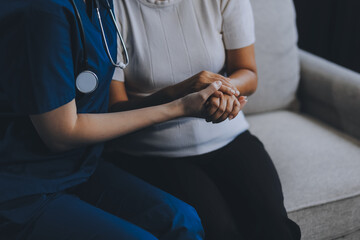 Female hands touching old female hand Helping hands take care of the elderly concept in hospital