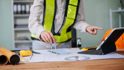 usiness people having consultation about wind energy at company office. on architectural project site and making model house.