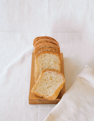 a loaf of bread on a wooden cutting board