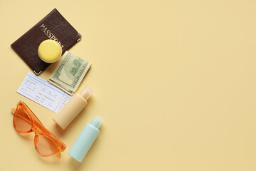 Composition with cosmetic travel kit, sunglasses, passport and ticket on color background