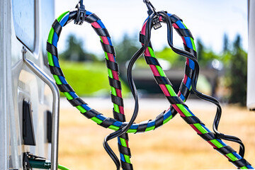 Bundle of wires and compression hoses connecting the big rig semi truck and semi trailer for the...