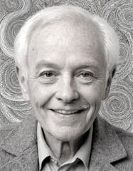 A portrait of an elderly man smiling for the camera