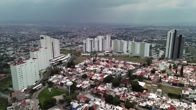 Aerial view of the city of Quer&eacute;taro capital during a cloudy day, houses and buildings of a town
