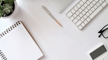 Ultra-sharp flat lay of a simple desk setup with a keyboard, notebook, and pen