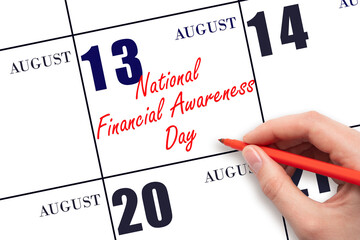 August 13. Hand writing text National Financial Awareness Day on calendar date. Save the date.