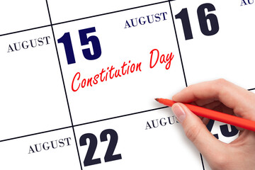 August 15. Hand writing text Constitution Day on calendar date. Save the date.