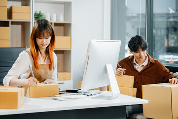Starting small businesses SME owners, two check online orders Selling products working with boxs freelance work , marketing, Business Success and Productivity.