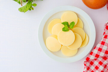 Sliced Egg tofu or bean curd in a white ceramic plate on white background