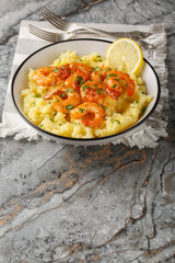 Hot Lemon Butter Shrimp with Mashed Potatoes closeup on the plate on the table, Vertical