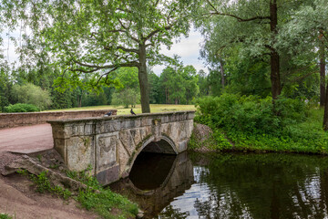 A bridge over a river with trees in the background