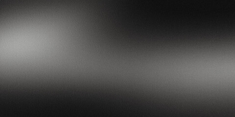 Spotlight creating grainy texture against black background