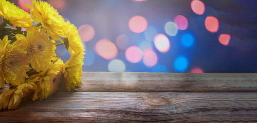 Bouquet of yellow Chrysanthemum on corner bottom right of vintage wooden table copy space, for florist or composing postcard and text with love letter