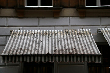 Dirty awning in the street