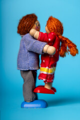 Wooden Family Hug in background blue