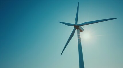 A wind turbine appears under a clear sky. The image, which was just submitted, generates renewable energy