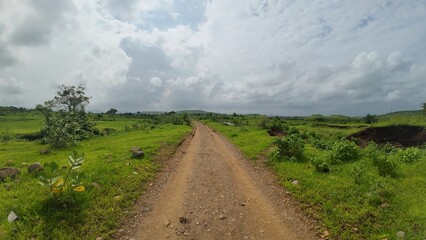 Serene Pathway through Lush Green Hills