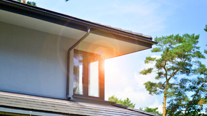 Upscale house in wooded area. Fragment of a single-family house facade. 