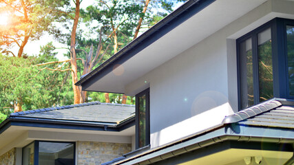 Upscale house in wooded area. Fragment of a single-family house facade. 