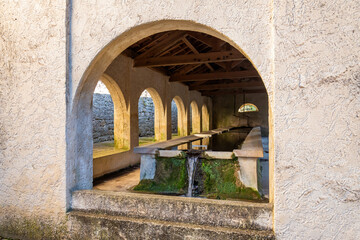 View of the washhouse in the small town of Mazaugues in the Var department, located at the eastern end of the Sainte-Baume massif, in the Provence region of France
