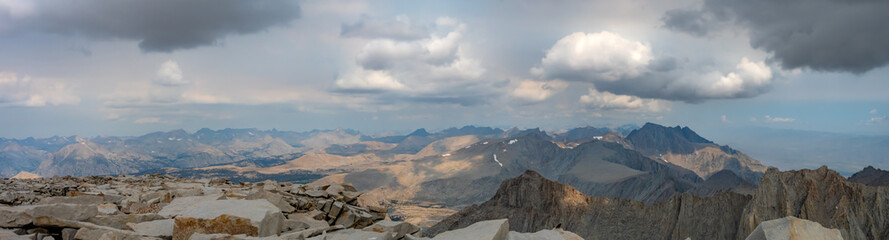 Panoramic view from the summit of Mt. Whitney in the summertime with rain clouds