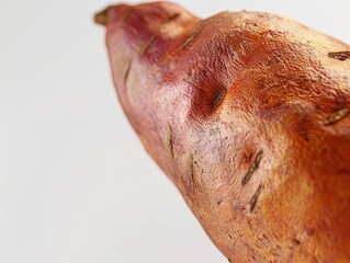 Naklejka premium Sweet Potato in Sharp Detail at Frame’s Golden Section, Rich Orange Color Stands Out, Striking Composition Highlights Freshness and Quality, Perfect for Food Photographycc