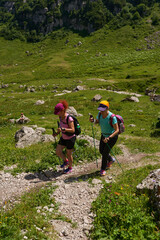Women with backpacks on a hiking trail