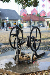 STARY SACZ, POLAND - JUNE 23, 2024: An ancient well on the market square of Stary Sacz.