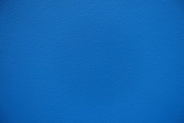 Fototapeta premium Close up of bright electric blue painted wall