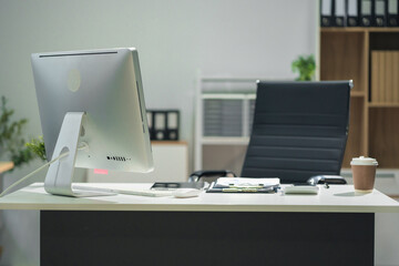 Workspace area with Mock up Blank screen computer desktop tablet smartphone and paperwork on the table in the office concept.