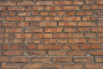 Background - red brick wall with standard stretcher bond