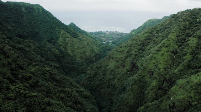 Teahupoo, Tahiti aerial drone view from the river in valley of mountain Orohena Aorai Ronui to the channel of 2024 Paris Olympics surfing spot. Paradise in Pacific Ocean crystal waters. Moana Disney