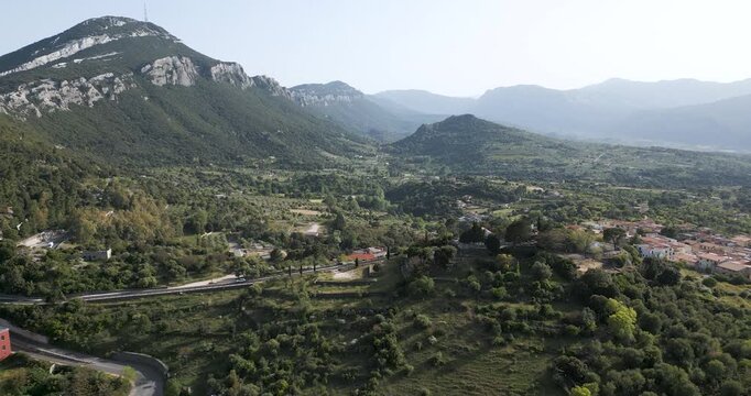 Beautiful Italian Village Of Dorgali Surrounded By Mountain Landscape At Sunrise.