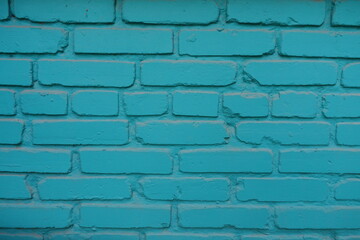 Backdrop - bright aqua blue painted brick wall