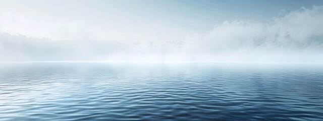 Fototapeta premium Lake merging into a mist, calm water, blue tone.