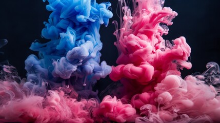 Fototapeta premium Blue and pink ink mixing in water, creating abstract shapes with a black background