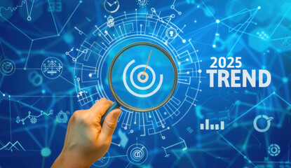 Hand holding magnifying glass and focusing on the word TREND Finding trends in business concepts.