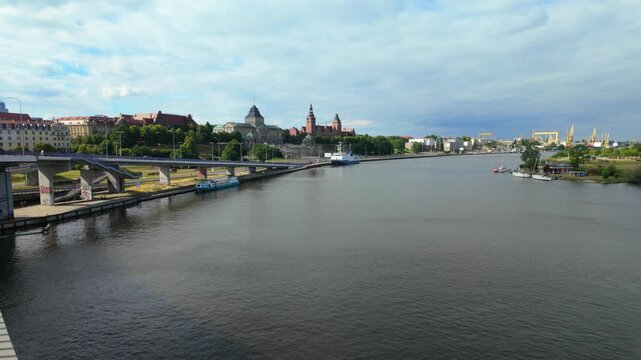 Scenic view of Szczecin's Chrobry Embankment along the Odra River on a cloudy day