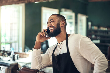 Happy, barber and man with phone call at work for small business, client and booking information....