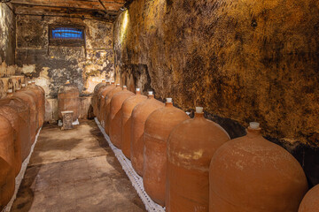 Wine ageing in stone jars in a wine cellar in the vicinity of Canelones, north of Montevideo.=