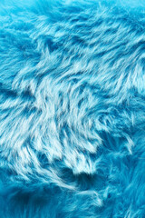 Obraz premium Photo of textured blue faux fur. Soft and delicate texture creates a feeling of comfort and coziness, ideal as a background in fashion projects, packaging design, advertising materials.