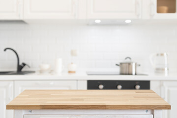 Rectangular wooden table on light and bright modern kitchen interior background