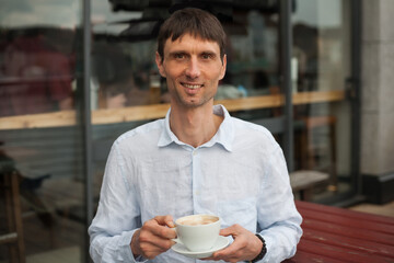 joyful cheerful middle-aged man in nature on a warm sunny day