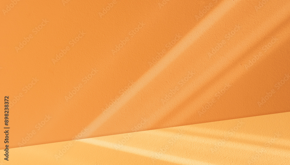 Poster autumn background,studio room with window light on orange wall concrete texture for product backgrou