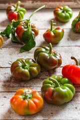 Studio shot of sweet Gogoshary Peppers on weathered wooden board