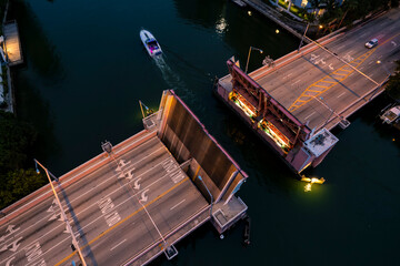 Miami Beach, Florida - Aerial perspective of a drawbridge at North Beach, with a boat passing...