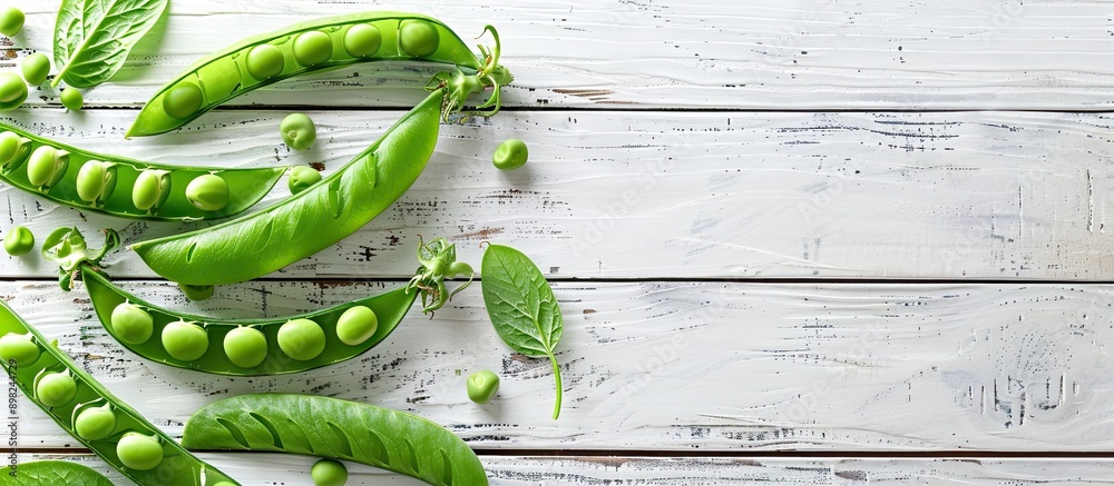 Aufkleber top down view of fresh green pea pods on a white wooden table with space for text or image insertion