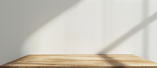 Blank wooden tabletop against a white background made as a mockup for design purposes with copy space image available