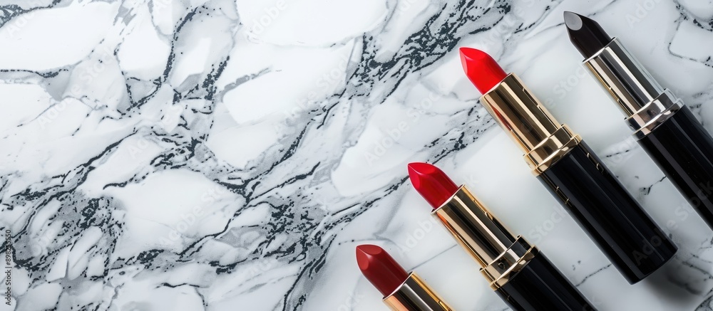 Poster cosmetic items such as lipsticks displayed on a marble backdrop with copy space image